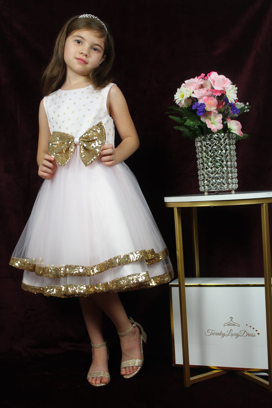 pink-snowflake dress with golden bow