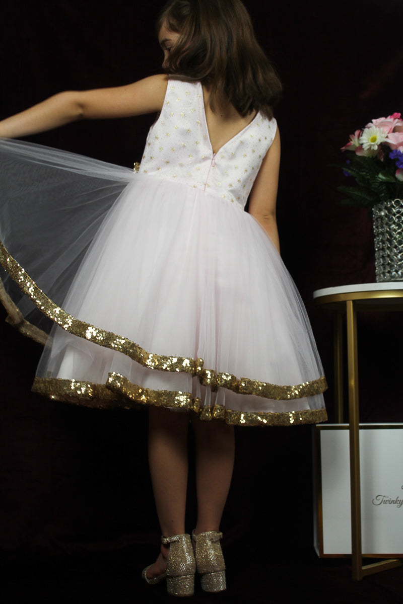 pink-snowflake dress with tiny golden bow